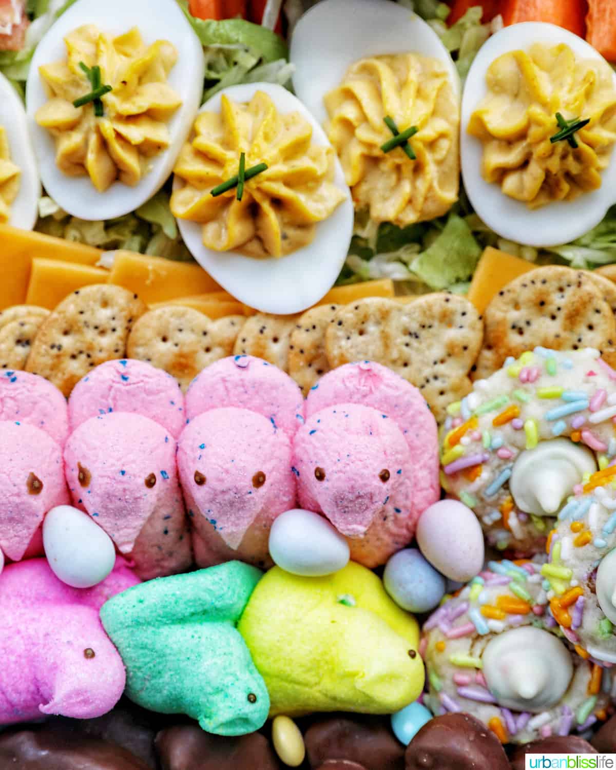 Easter Charcuterie Board with savory and sweet snacks.
