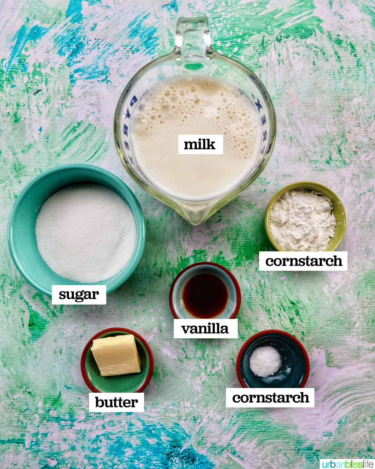 bowls of ingredients to make homemade vanilla pudding.