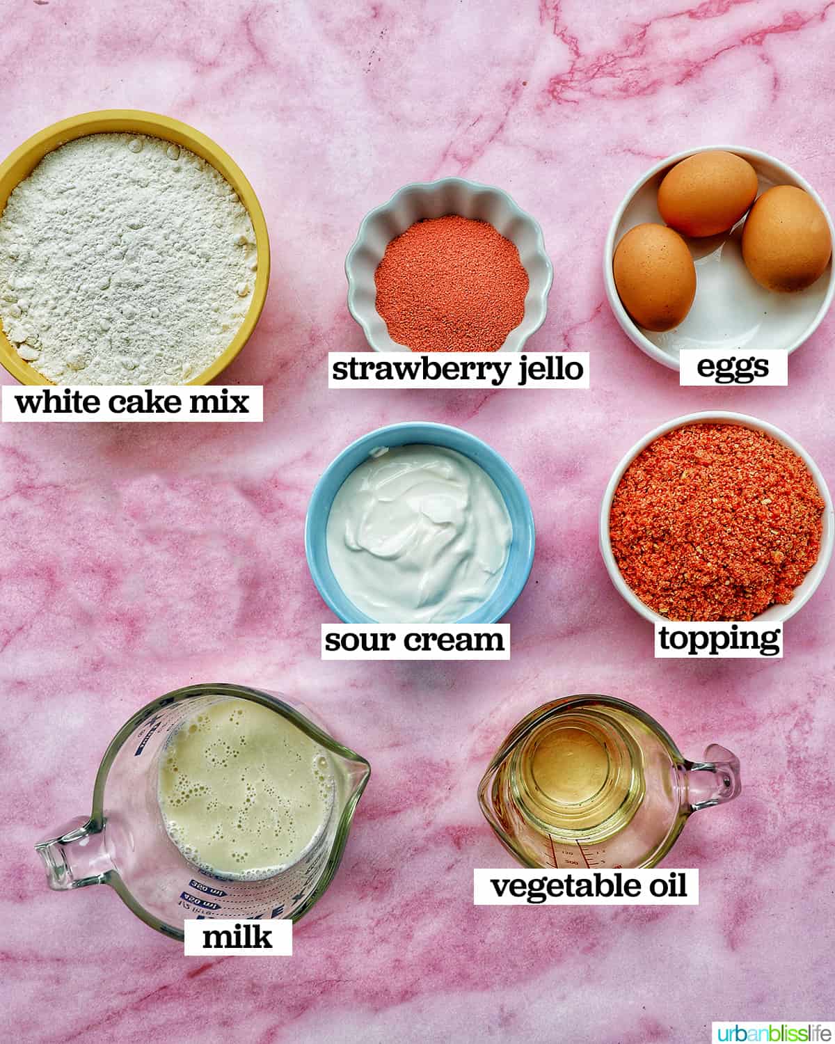 bowls of ingredients to make strawberry crunch cupcakes.