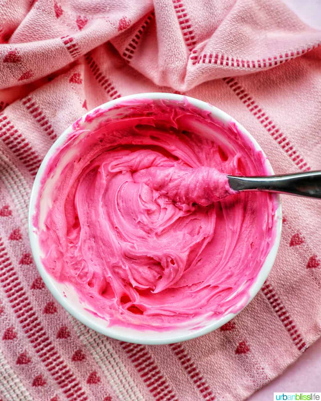 bowl of bright pink frosting.