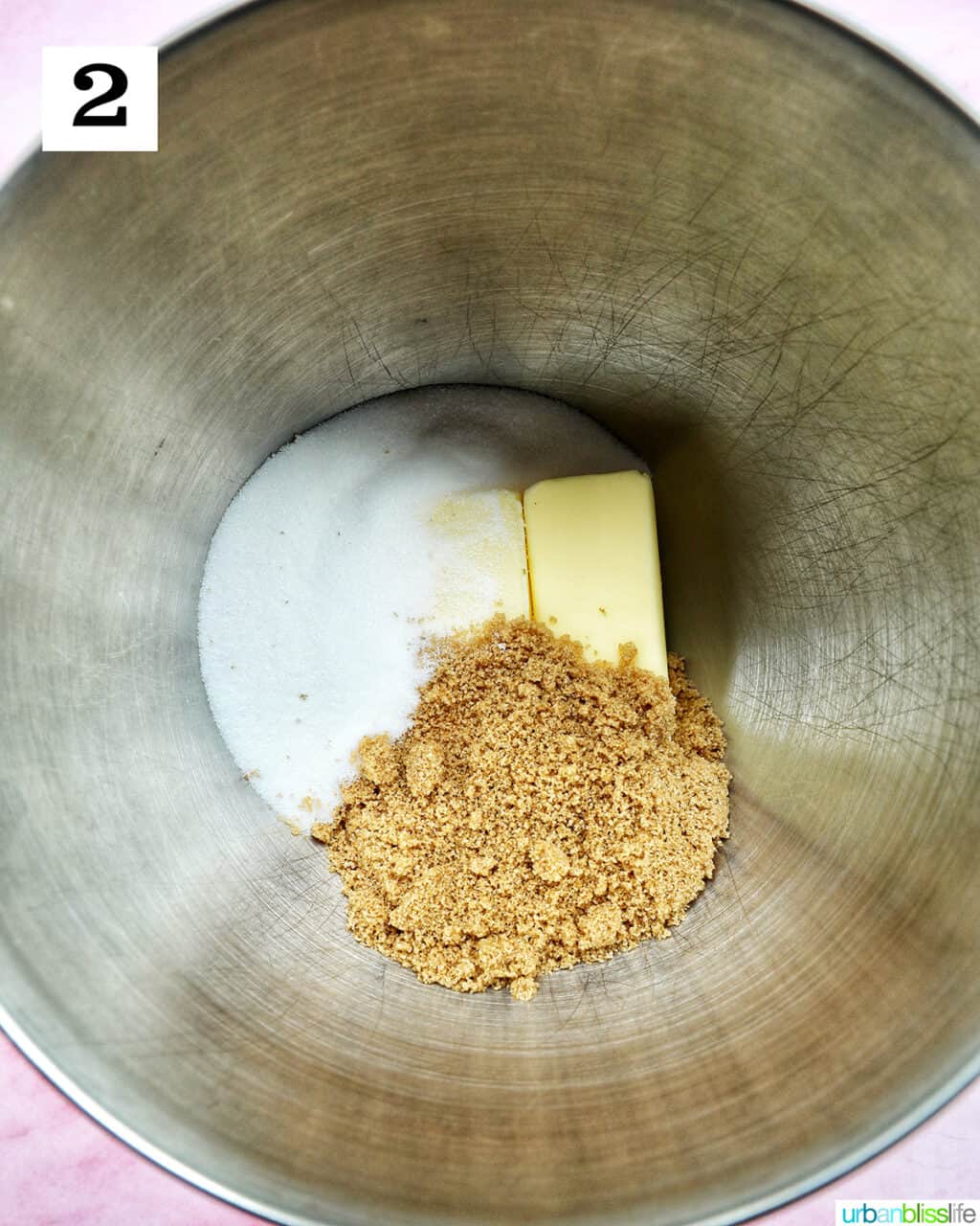 butter and two sugars in a stand mixer bowl.
