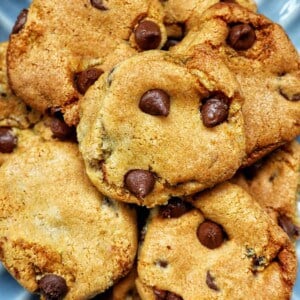 stack of air fryer chocolate chip cookies on a plate.