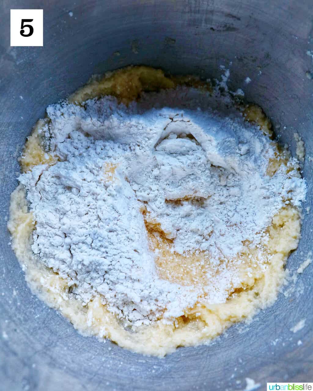 dry ingredients added to wet ingredients in a bowl.
