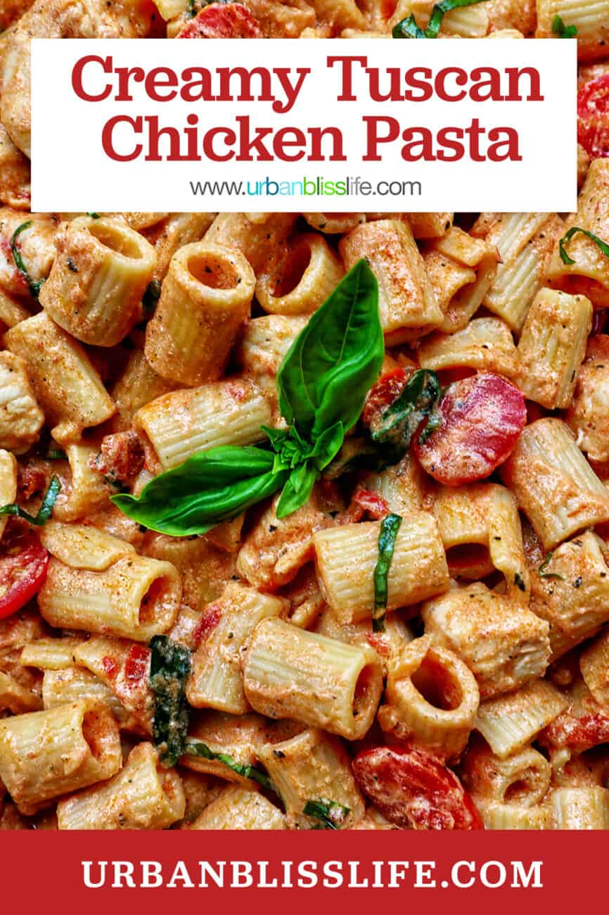 rigatoni pasta in a creamy Tuscan sauce with chicken, tomatoes, and herbs with title text that reads "Creamy Tuscan Chicken Pasta."