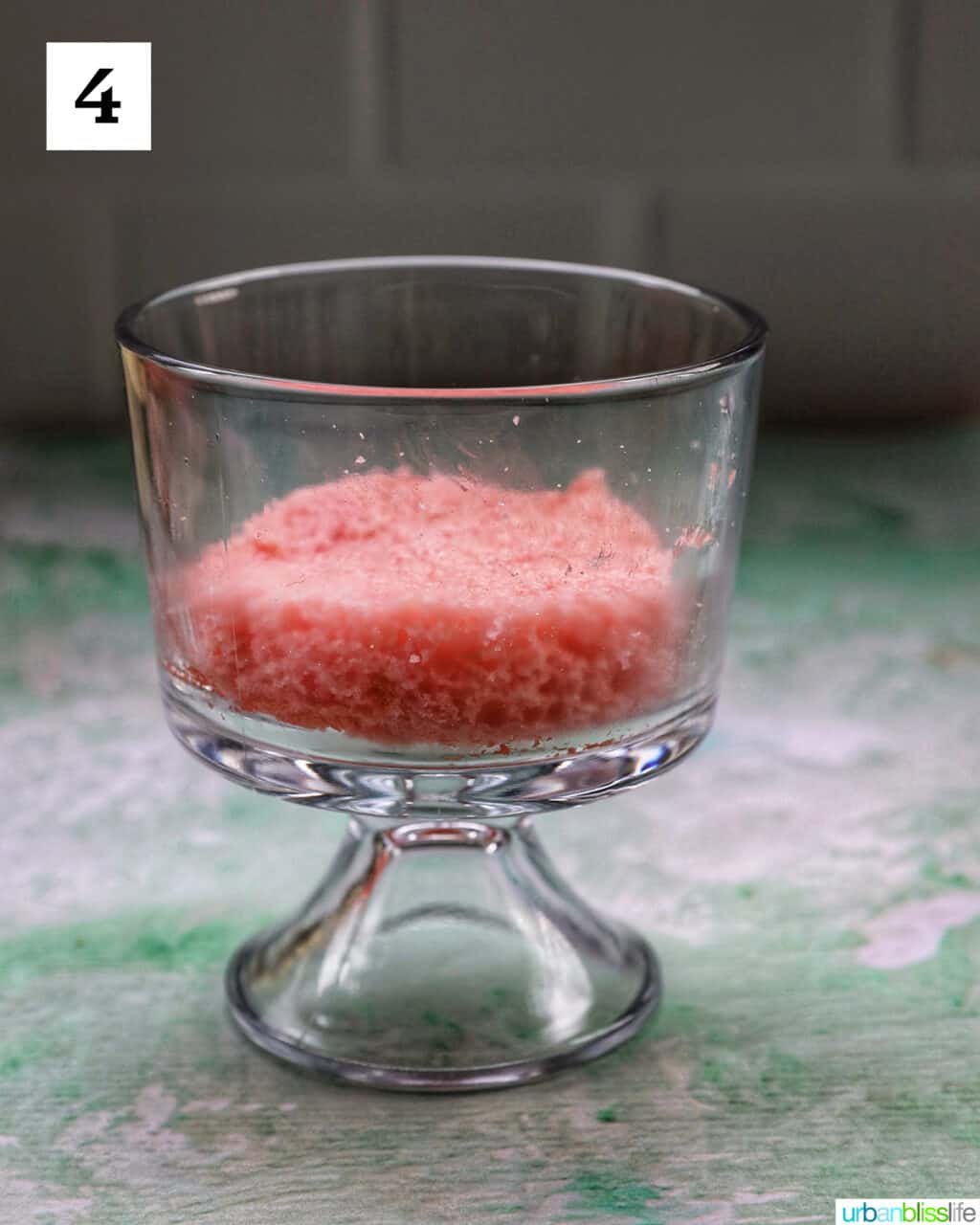 layer of pink cake in a trifle bowl.