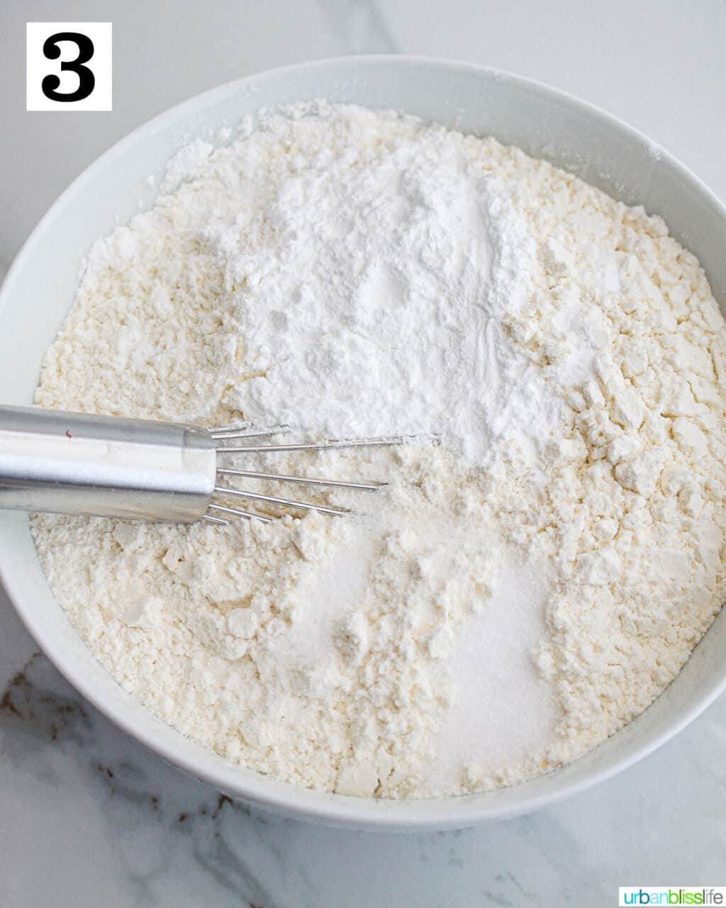 whisk in a bowl with dry ingredients to make cupcakes.