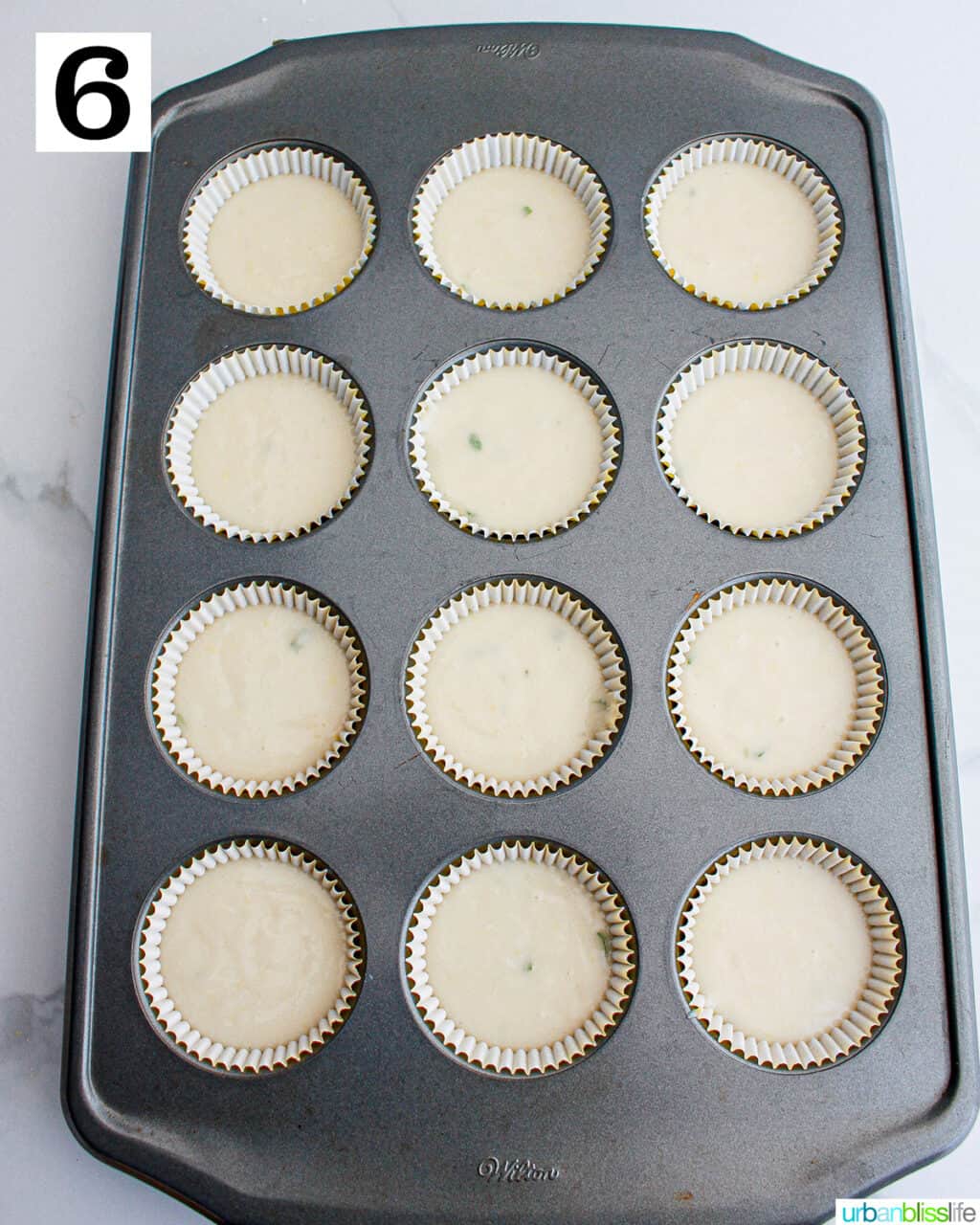 lemon basil cupcakes in a cupcake pan.