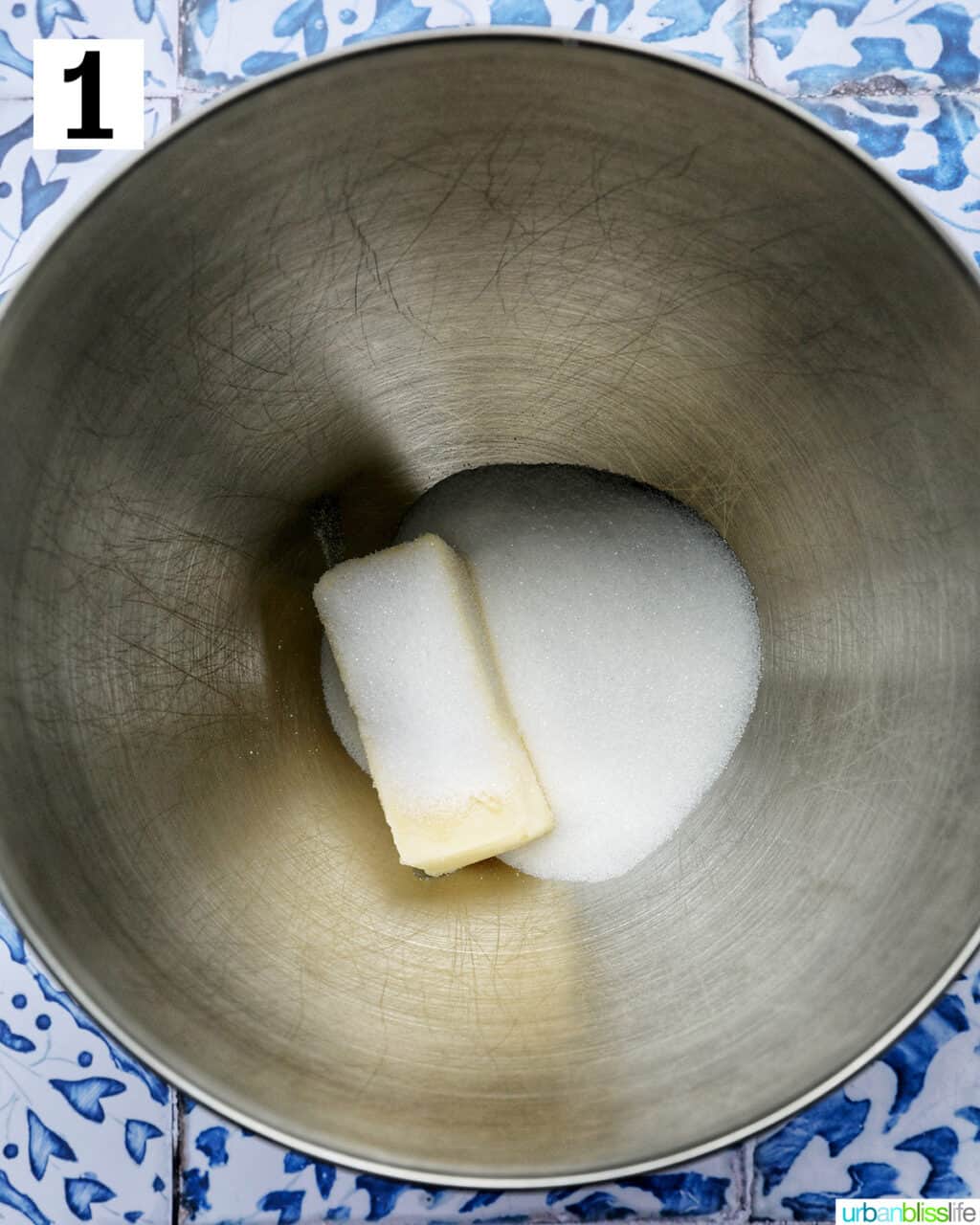 butter and sugar in a stainless steel bowl.