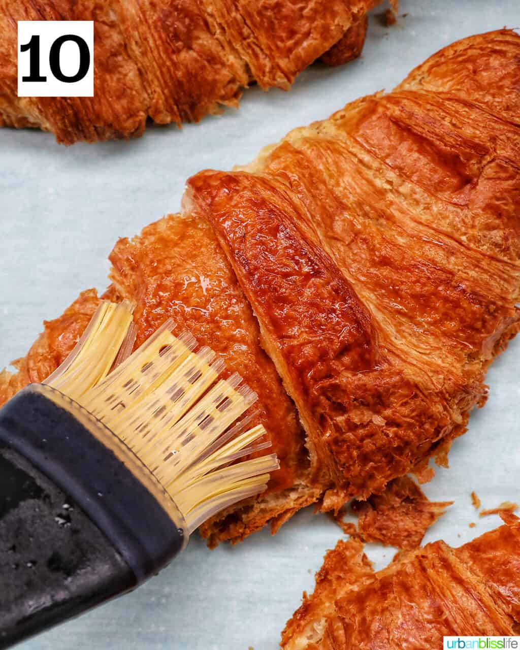 pastry brush brushing croissant.