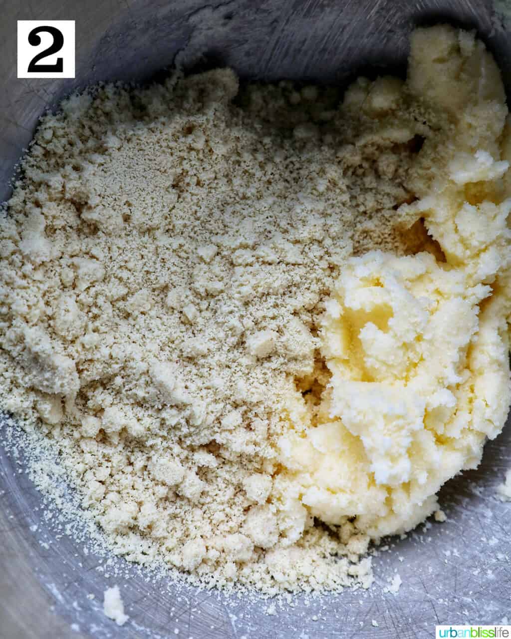 sugar and butter in a stainless steel mixing bowl.