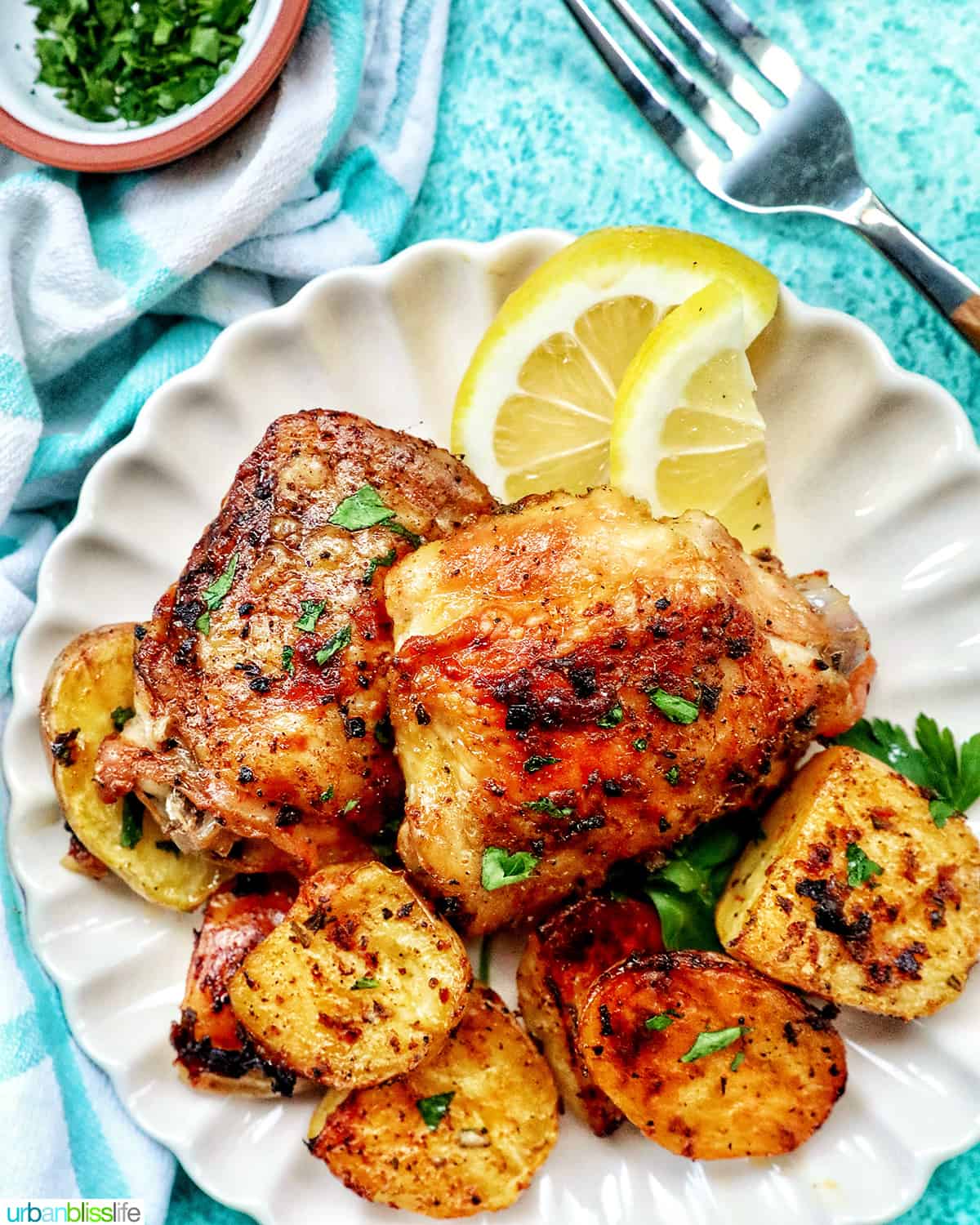 plate of chicken and potatoes.