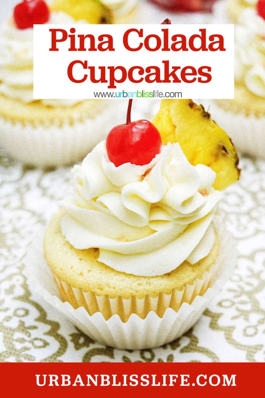 pina colada cupcakes with slice of pineapple on patterned table with title text overlay.