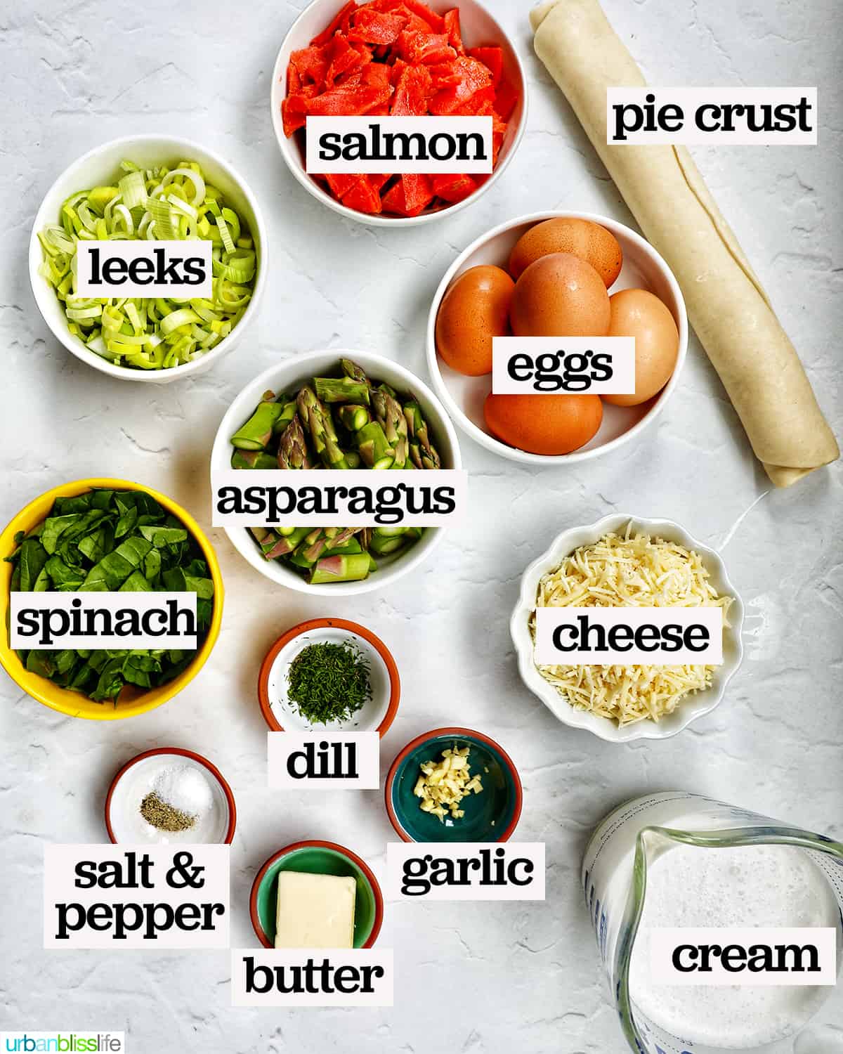 bowls of ingredients to make salmon quiche, with text overlay.