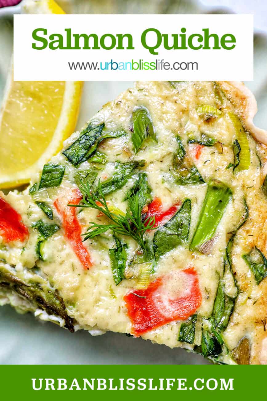 slice of salmon quiche with asparagus and leeks, and a slice of lemon on the side.