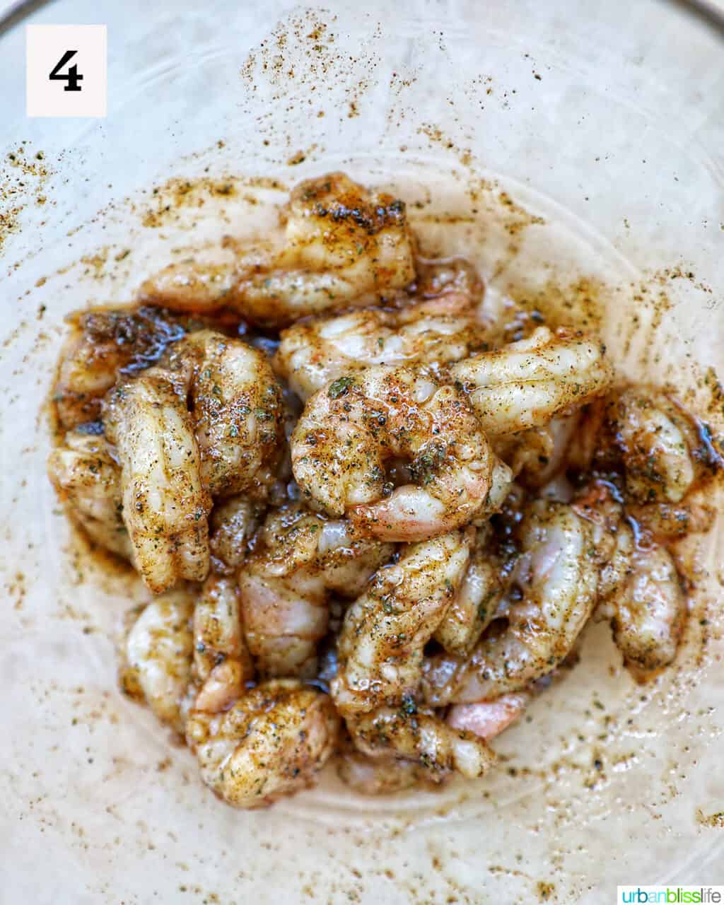 bowl with seasoned raw shrimp.