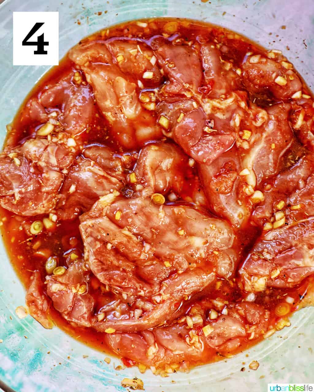 chicken marinating in an Asian marinade sauce.