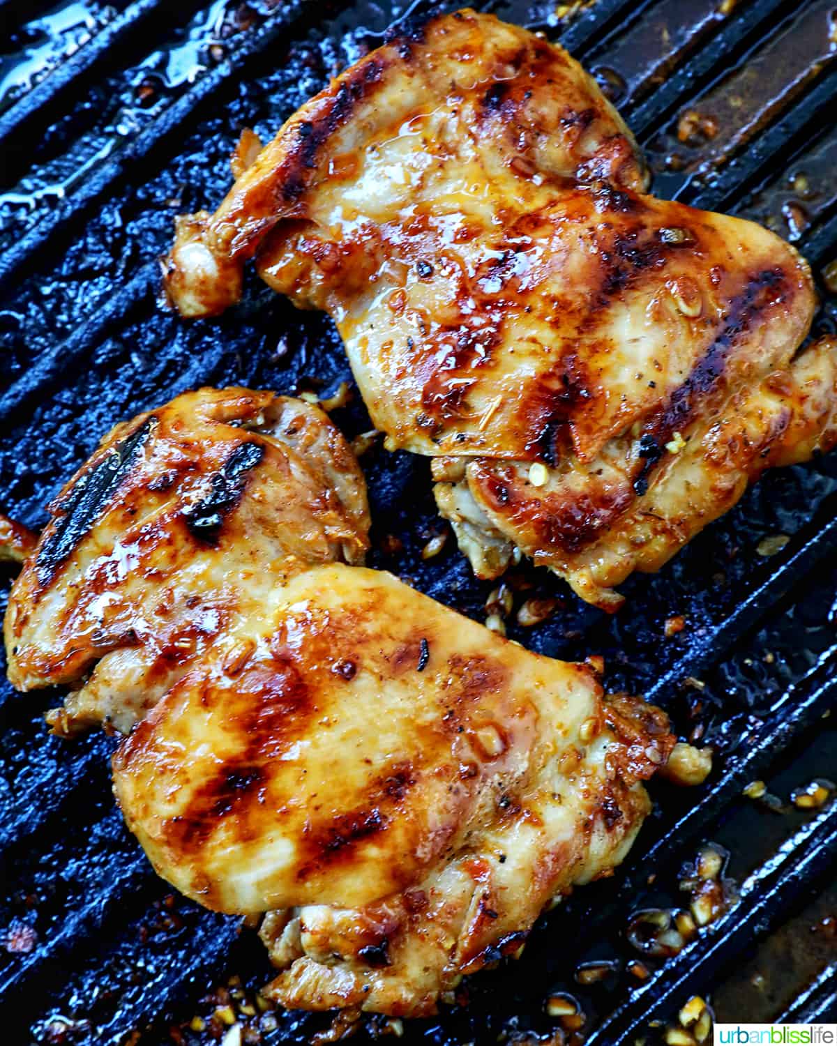 chicken grilling on a grill pan.