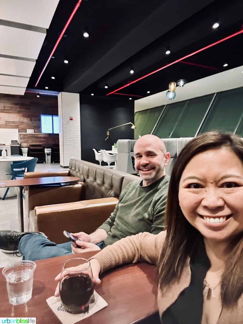 Marlynn and Alain Schotland at Alaska Airlines Lounge in JFK Airport.