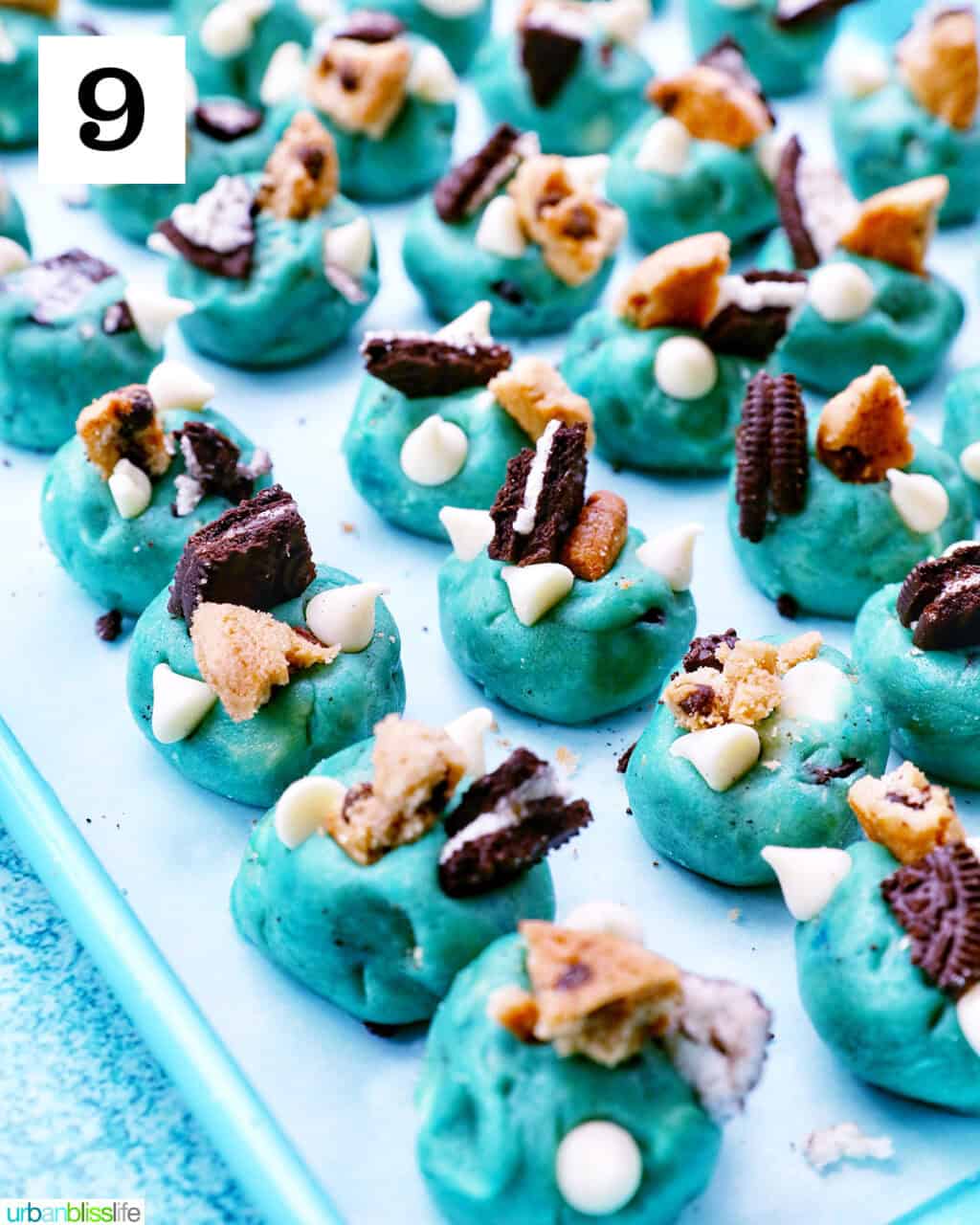Cookie Monster Cookie dough balls on a baking sheet.