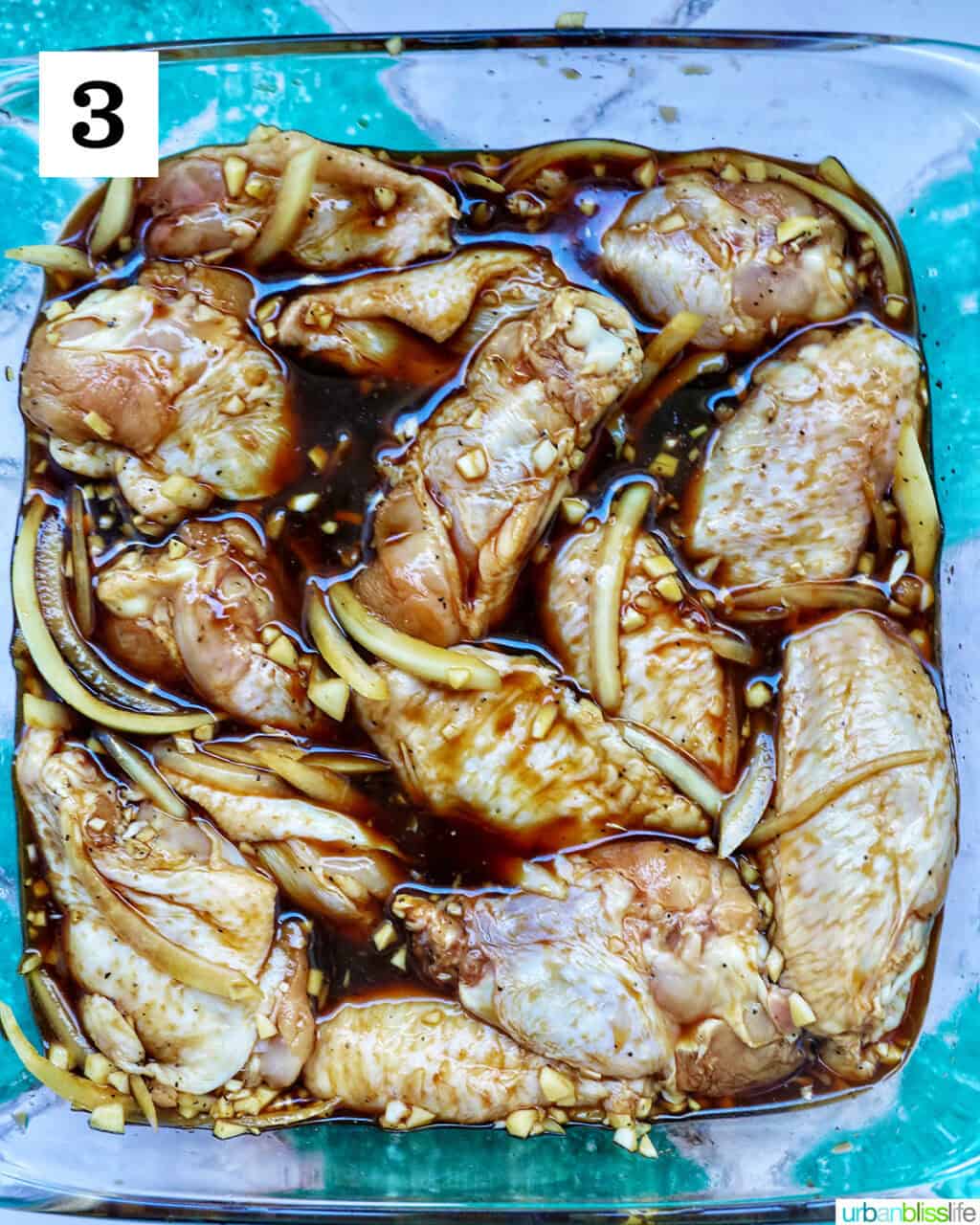 chicken marinating in adobo sauce.