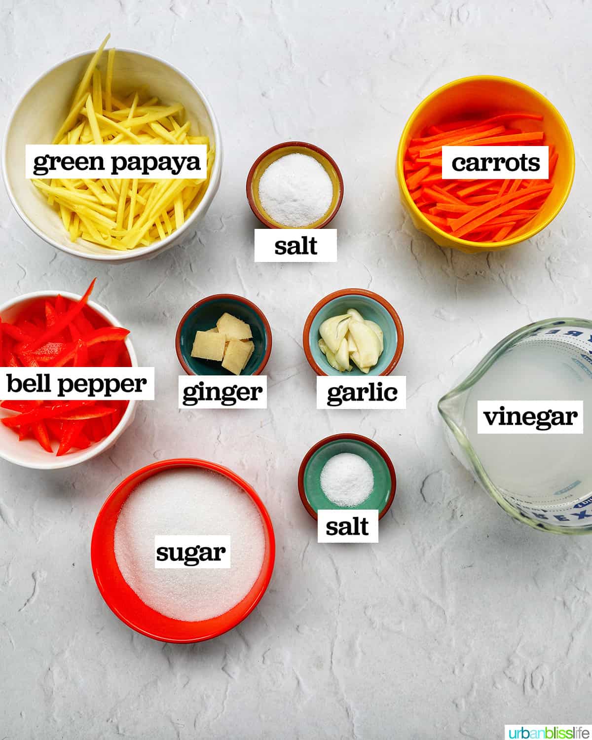 bowls of ingredients to make Filipino atchara condiment.