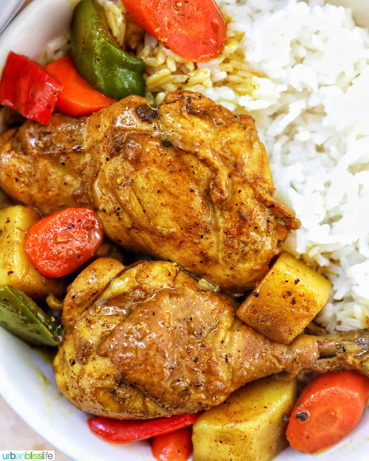 Filipino Chicken Curry with vegetables and white rice.