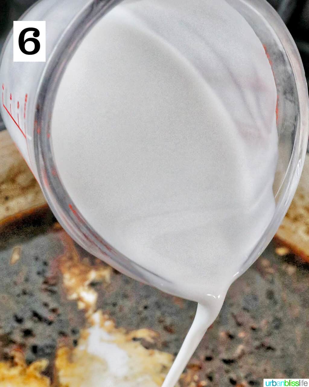pouring coconut milk into a pan.