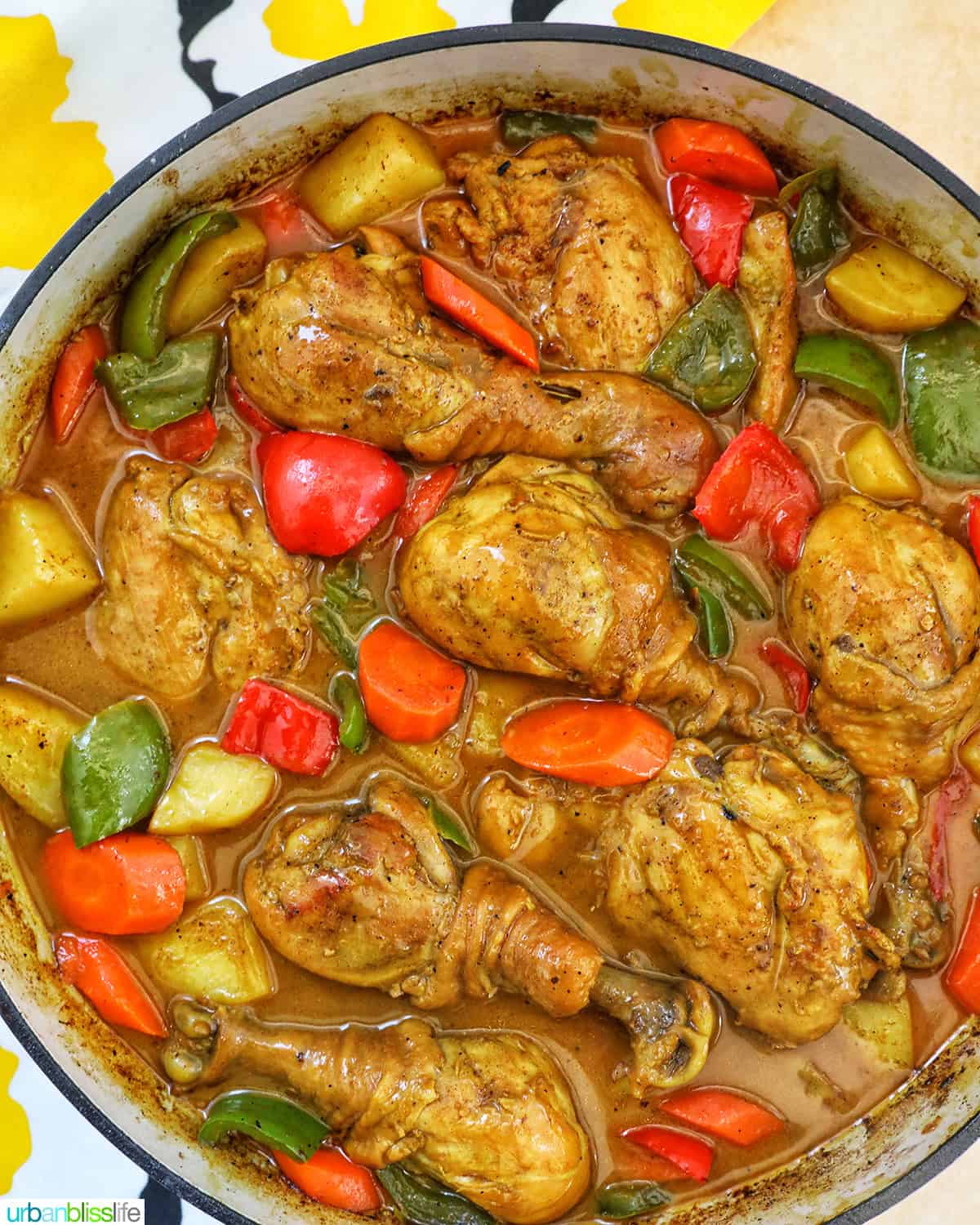 Filipino Chicken Curry with vegetables in a large pan.