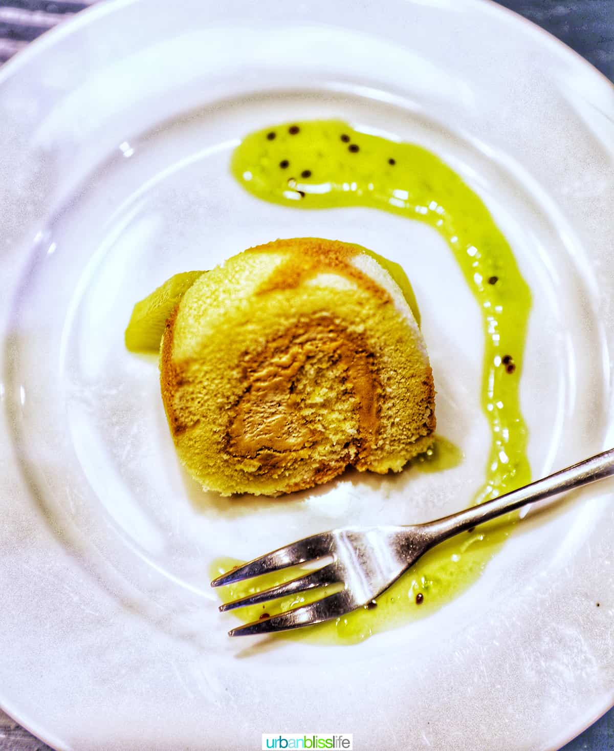 slice of Japanese mochi cake roll on a plate with fork.