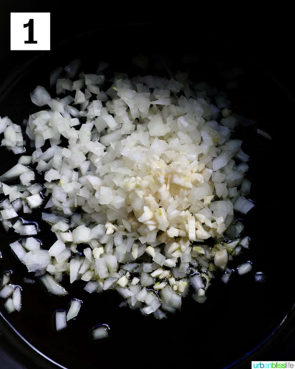 onions and garlic cooking in a large pot.