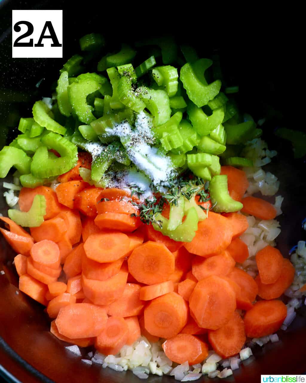 carrots, celery, onions and garlic in a pot.