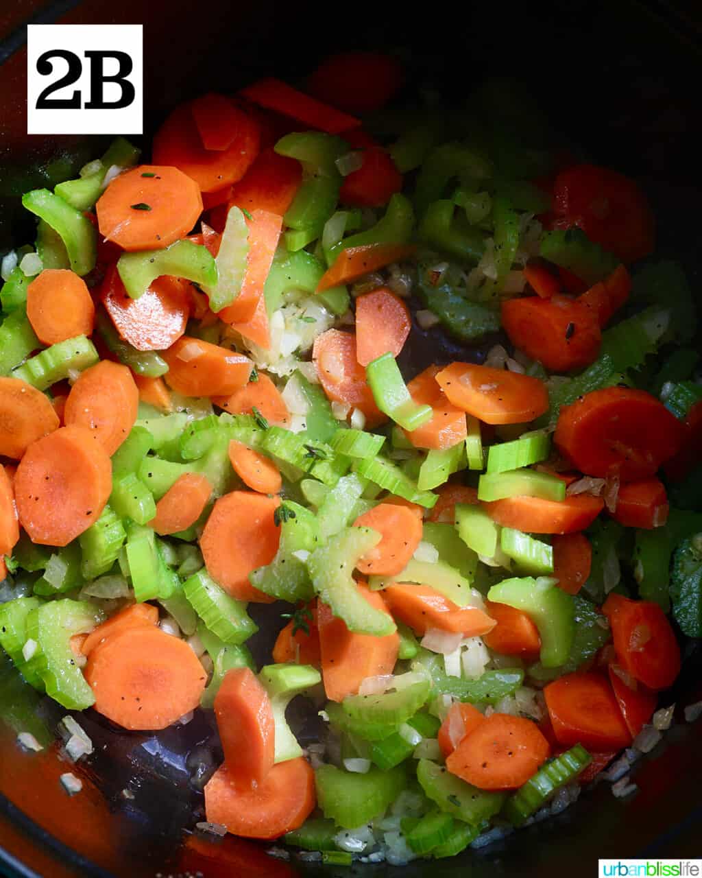 carrots, celery, onions and garlic in a pot.