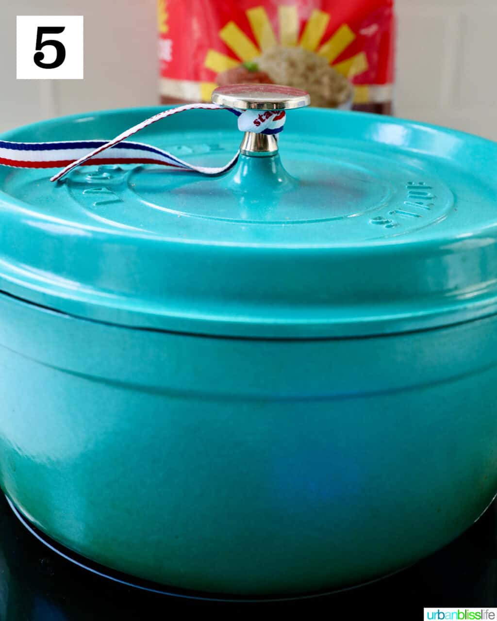 blue dutch oven with lid on.