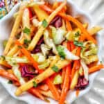 mango slaw with cabbage, carrots, red bell pepper, mango.