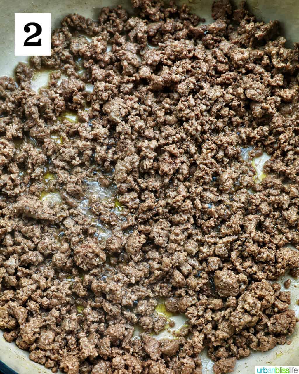ground beef cooked in a pan.