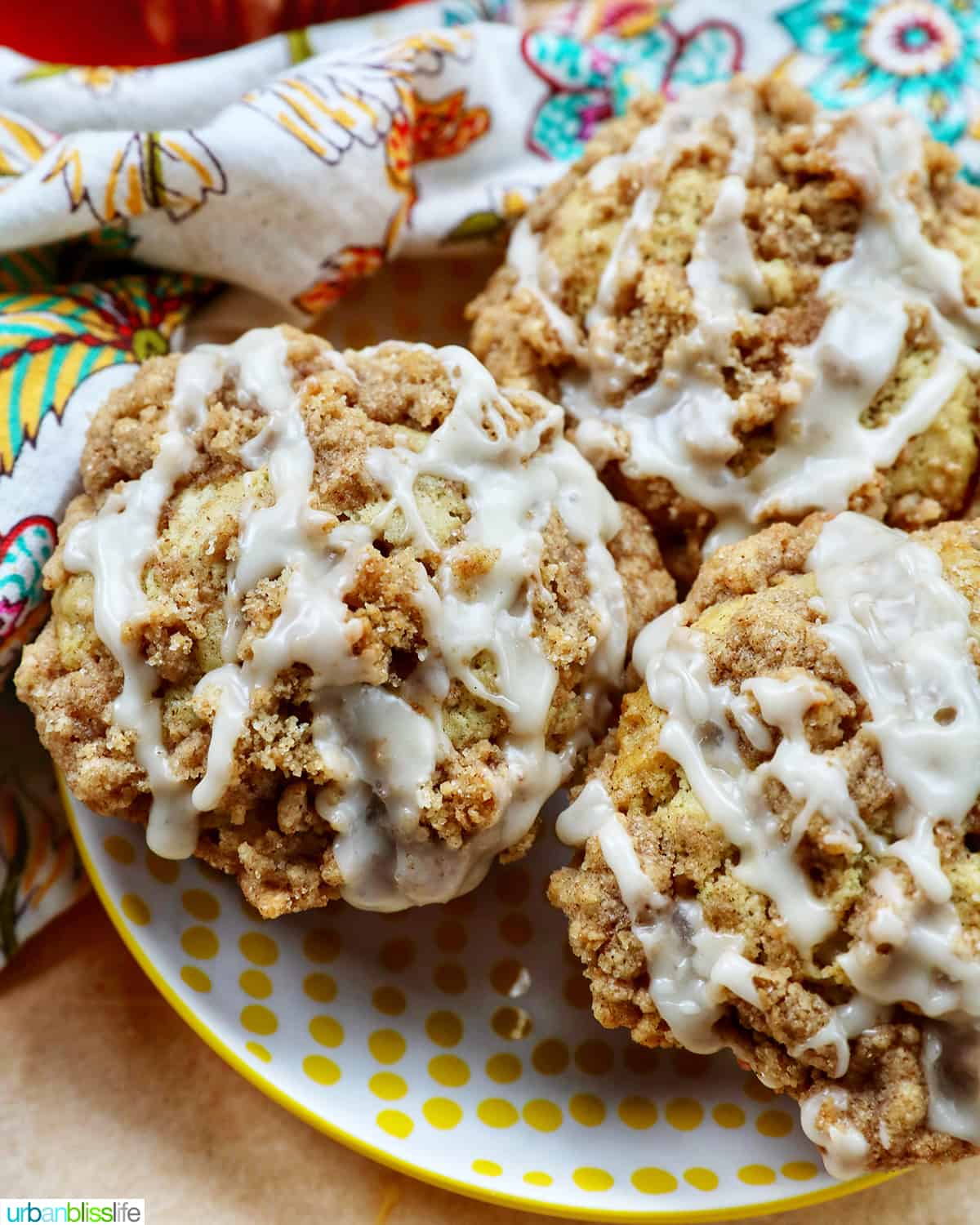 vegan streusel muffins with glaze on a plate.