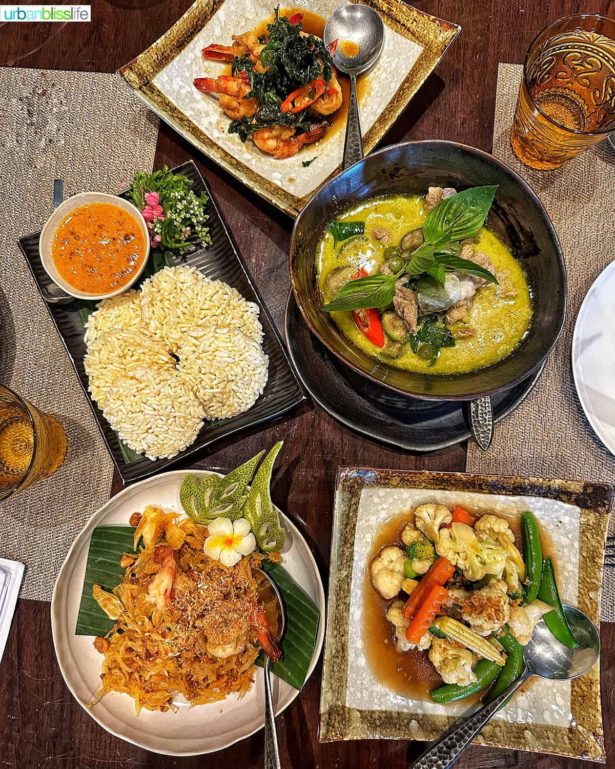 Thai food dishes on a dining table at the Jim Thompson house  restaurant in Bangkok, Thailand.