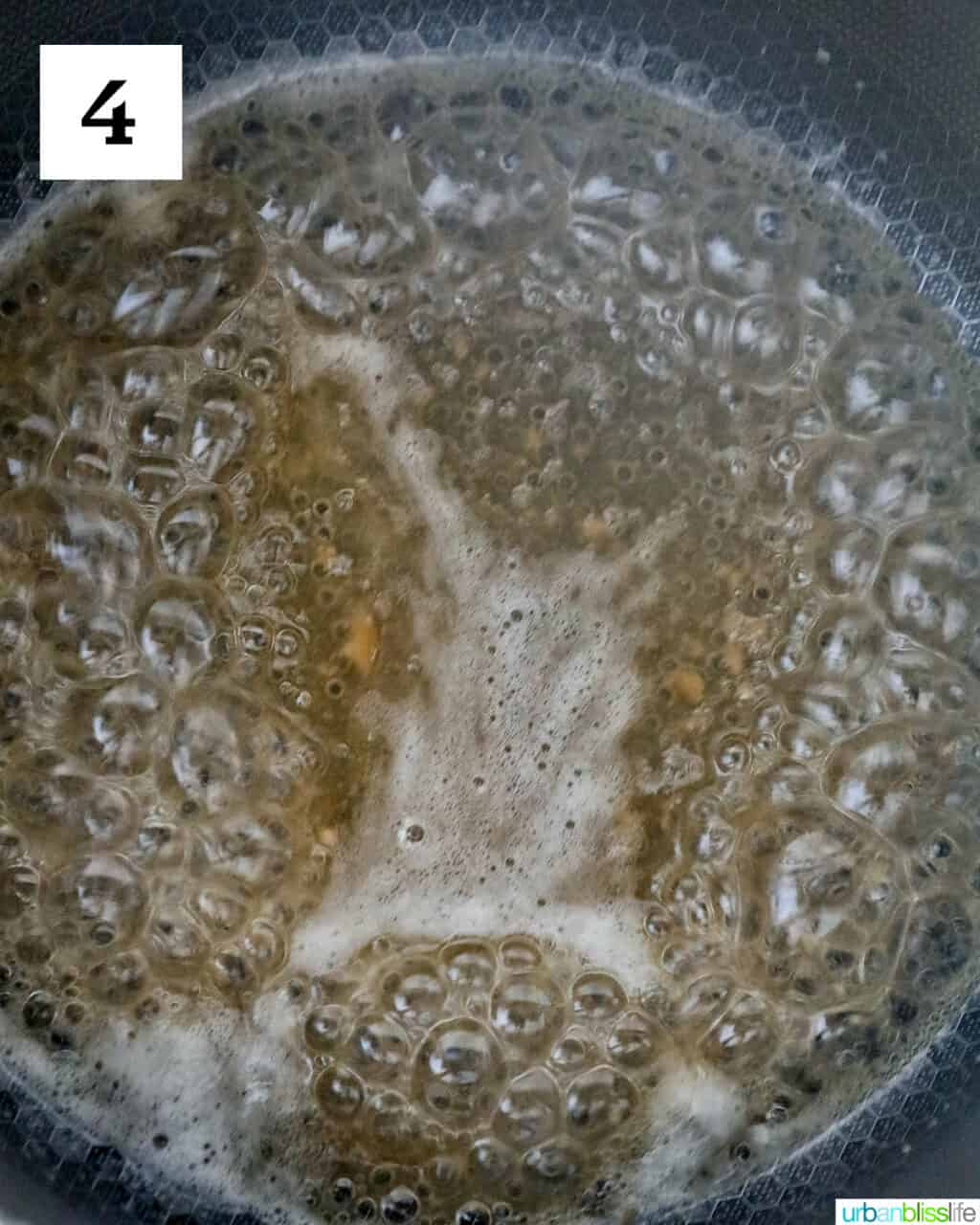 water and fruit pectin boiling in a saucepan.