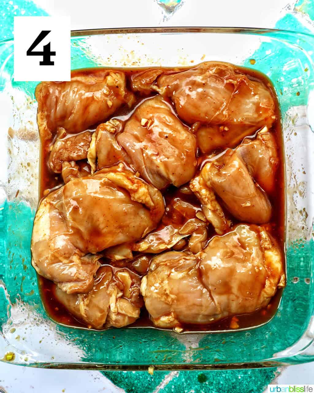 chicken thighs marinating in BBQ sauce.