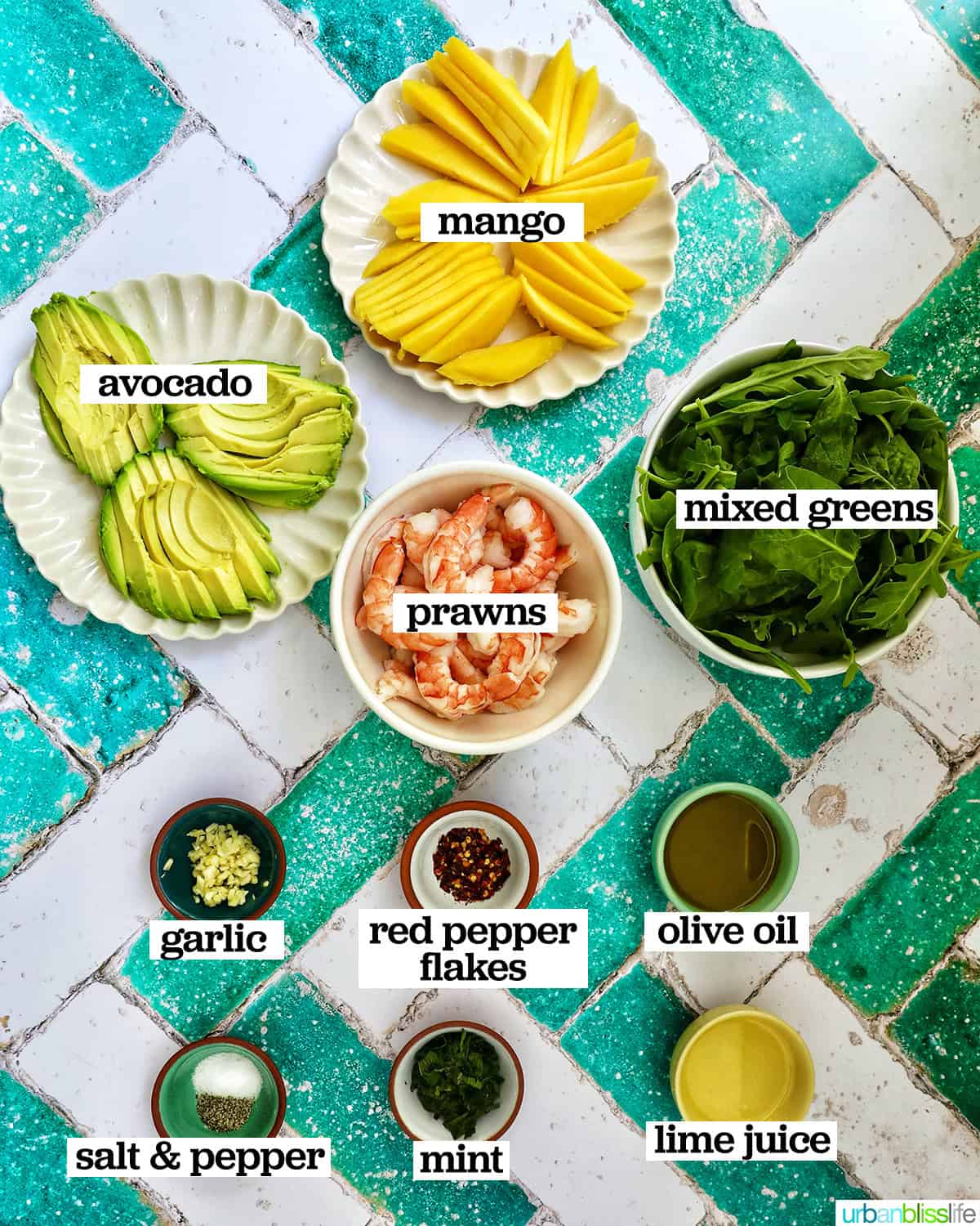 bowls of ingredients to make mango avocado prawn salad.