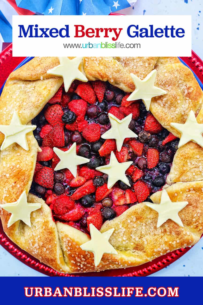 a mixed berry galette: mixed berries in pie dough with white chocolate stars on a red plate with title text overlay.
