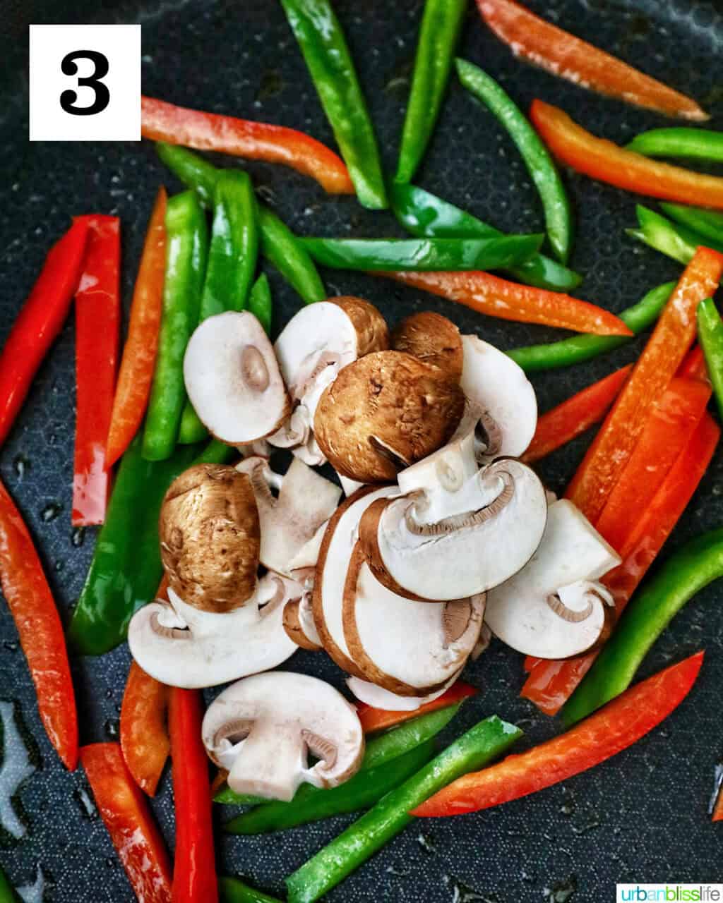 sautéed peppers and onions cooking in a skillet.