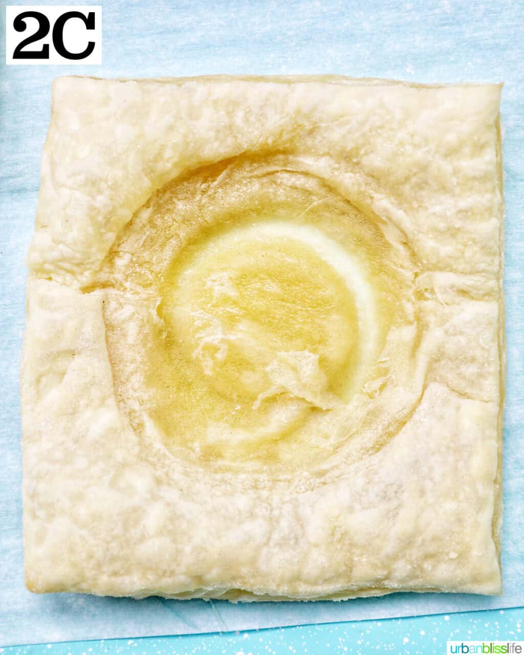 puff pastry square with a circle indentation in the middle.