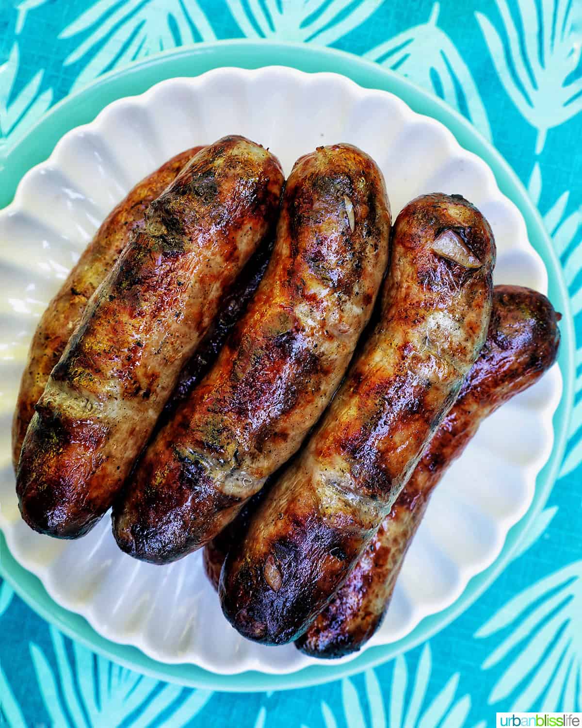 grilled bratwurst on a plate.