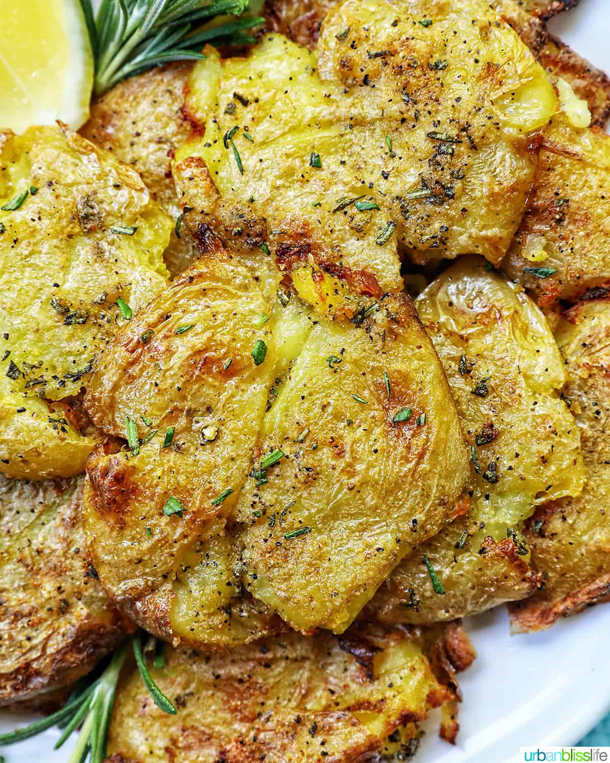 smashed potatoes on a plate.