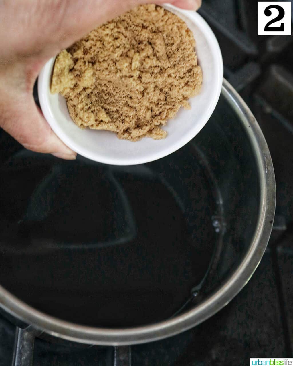 bowl of brown sugar over a saucepan of balsamic glaze.