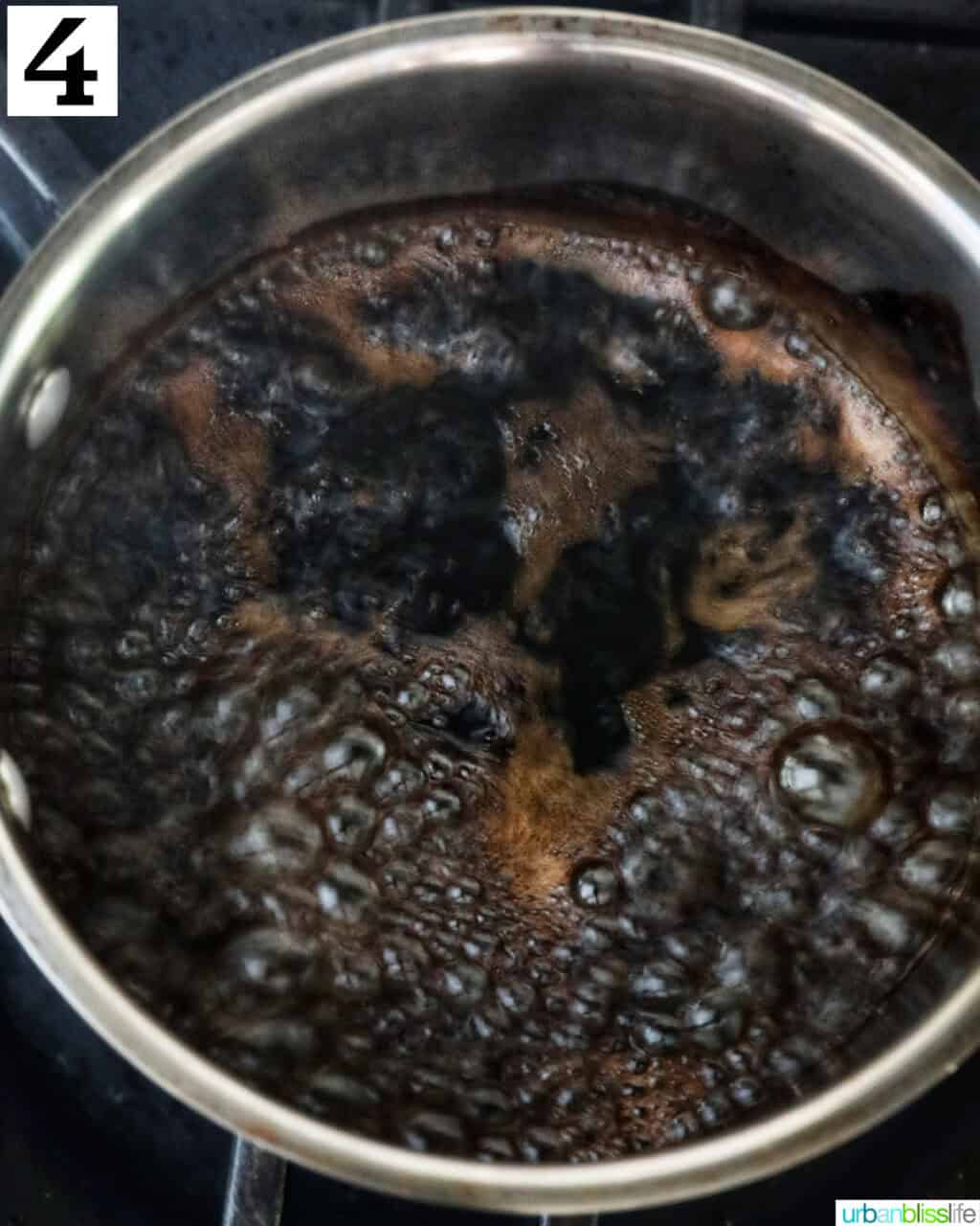 balsamic glaze boiling in a saucepan.