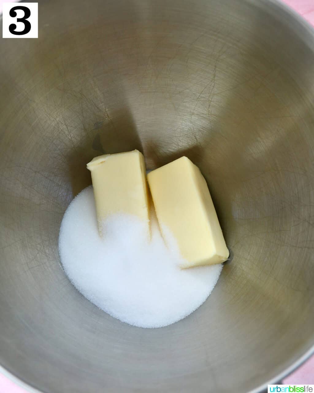 butter and sugar in a stainless steel bowl.
