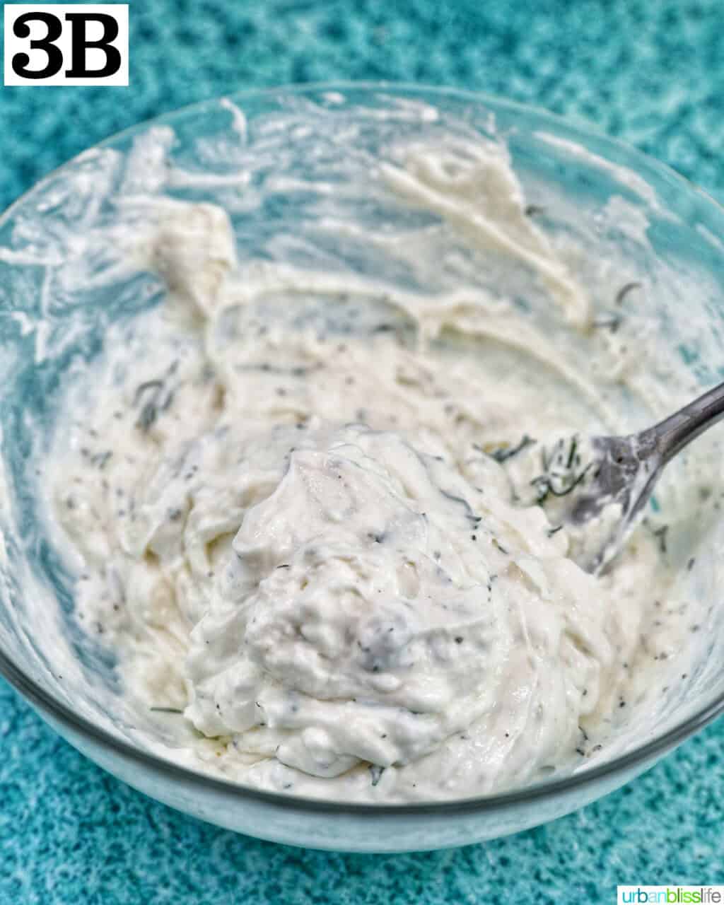 herb cream cheese spread in a bowl.