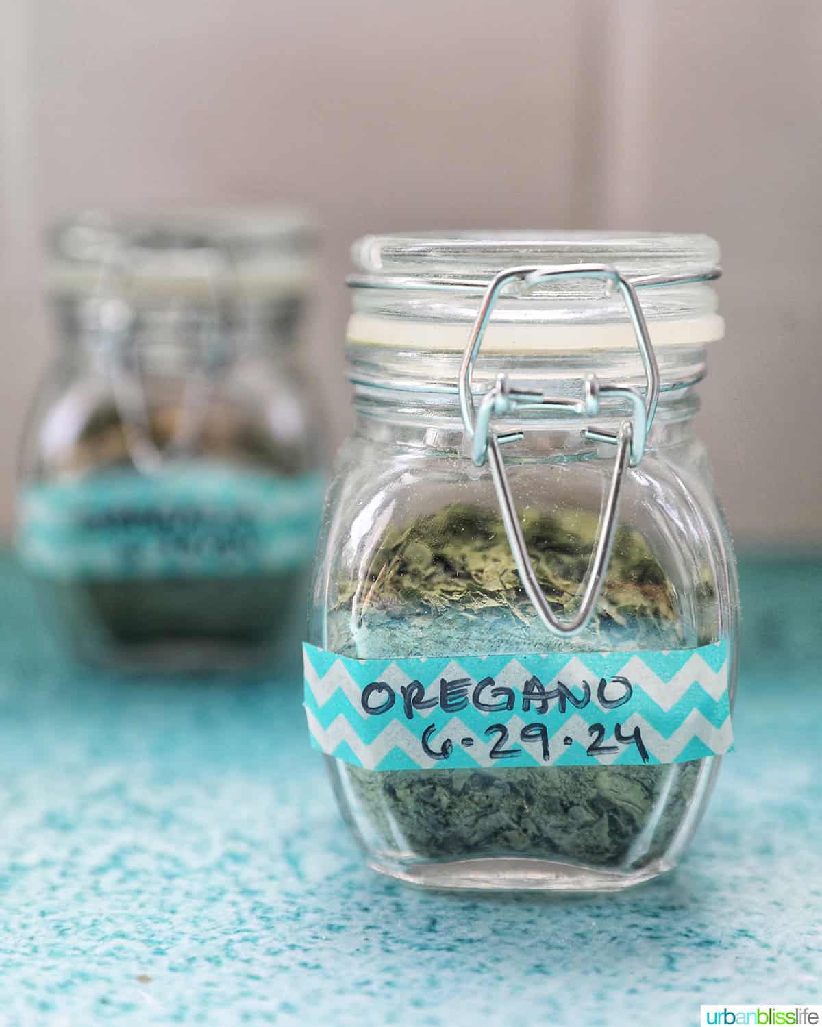 dried oregano in labeles jars.